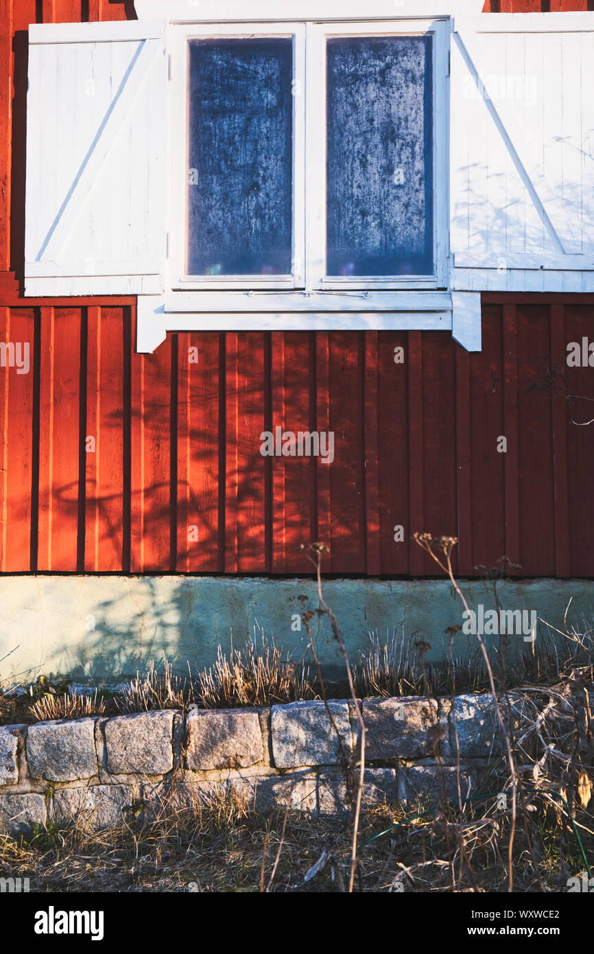 Condensation on window of traditional falu red cabin, Sweden, Scandinavia Stock Photo