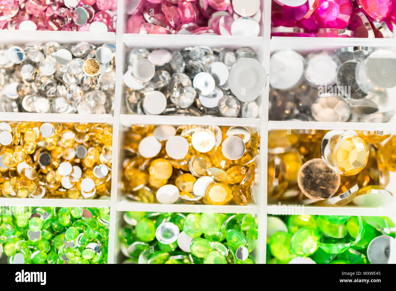 Comparing Craft Rhinestones Color and size variety of rhinestones in the craft box Stock Photo - Alamy