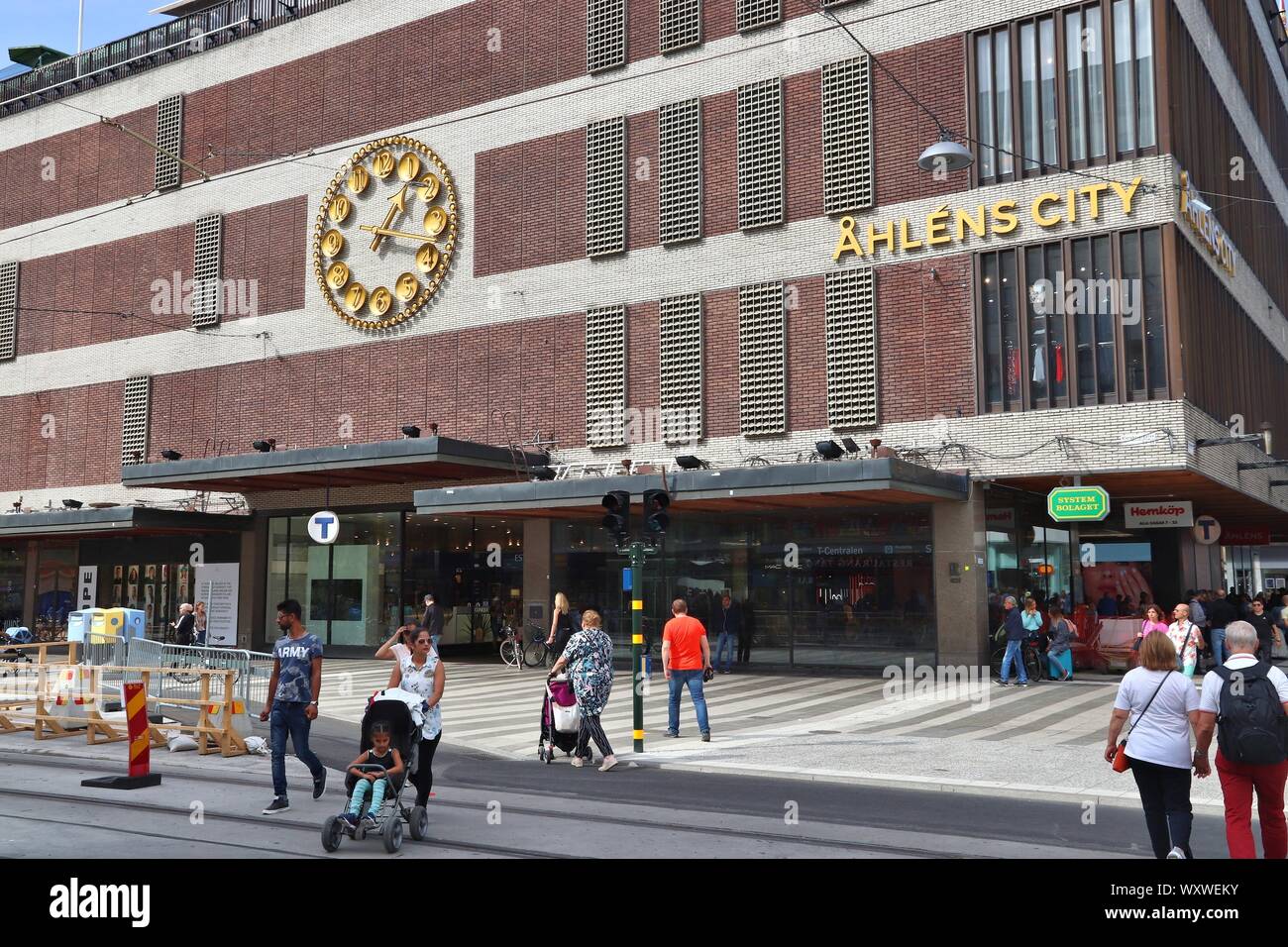 STOCKHOLM, SWEDEN - AUGUST 23, 2018: People walk by Ahlens City department store in Drottninggatan street, Stockholm. Drottninggatan is one of most re Stock Photo