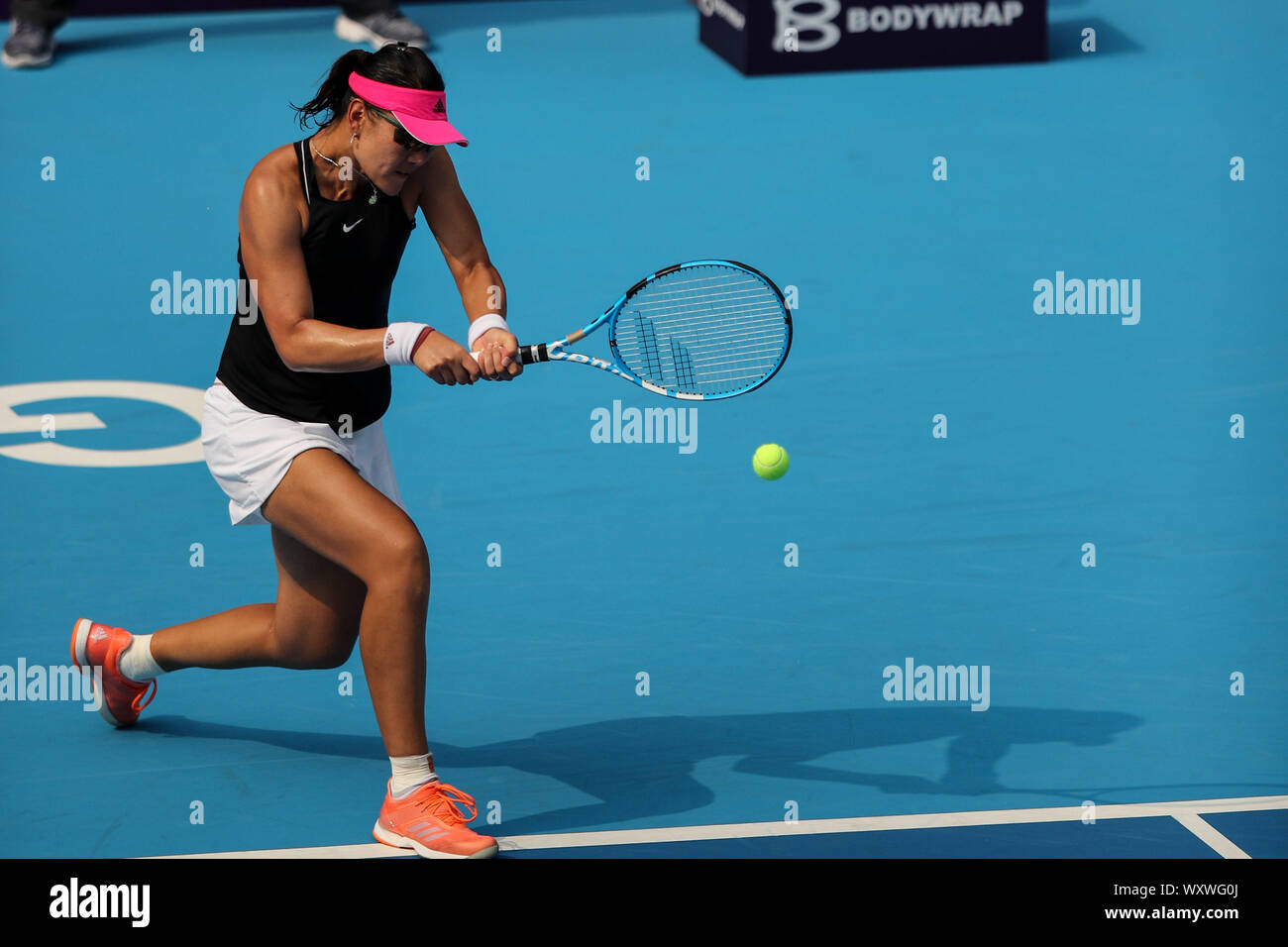 Chinese tennis player Zheng Saisai catches the ball at the first round of  Women's Single Duan
