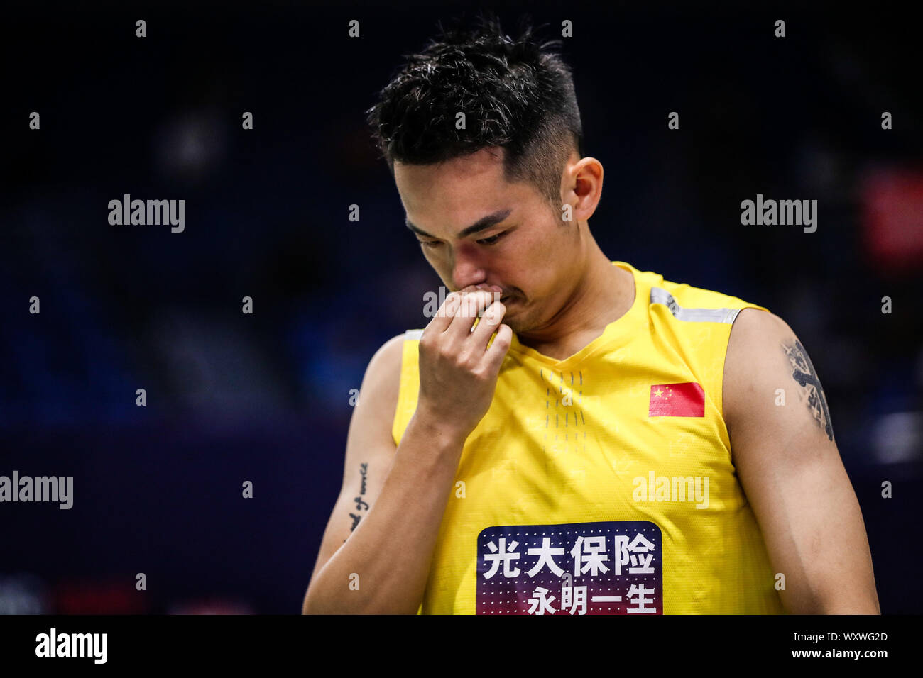 Chinese professional badminton player Lin Dan competes against Japanese professional badminton player Kento Momota at the first round of men's single of VICTOR China Open 2019, in Changzhou city, east China's Jiangsu province, 17 September 2019. Chinese professional badminton player Lin Dan was defeated by Japanese professional badminton player Kento Momota with 0-2 at the first round of men's single of VICTOR China Open 2019, in Changzhou city, east China's Jiangsu province, 17 September 2019. Stock Photo