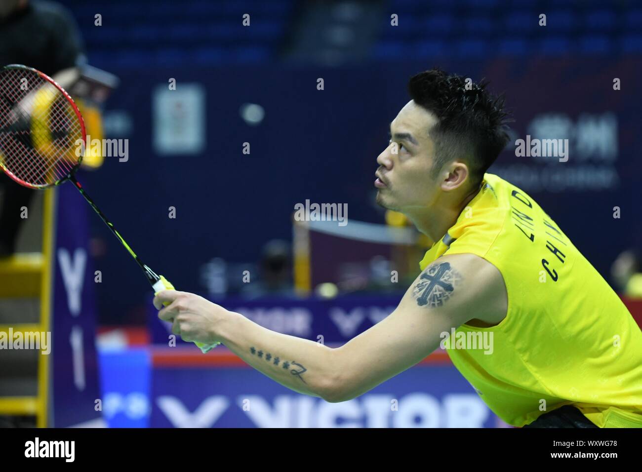 Chinese professional badminton player Lin Dan competes against Japanese  professional badminton player Kento Momota at the first round of men's  single of VICTOR China Open 2019, in Changzhou city, east China's Jiangsu