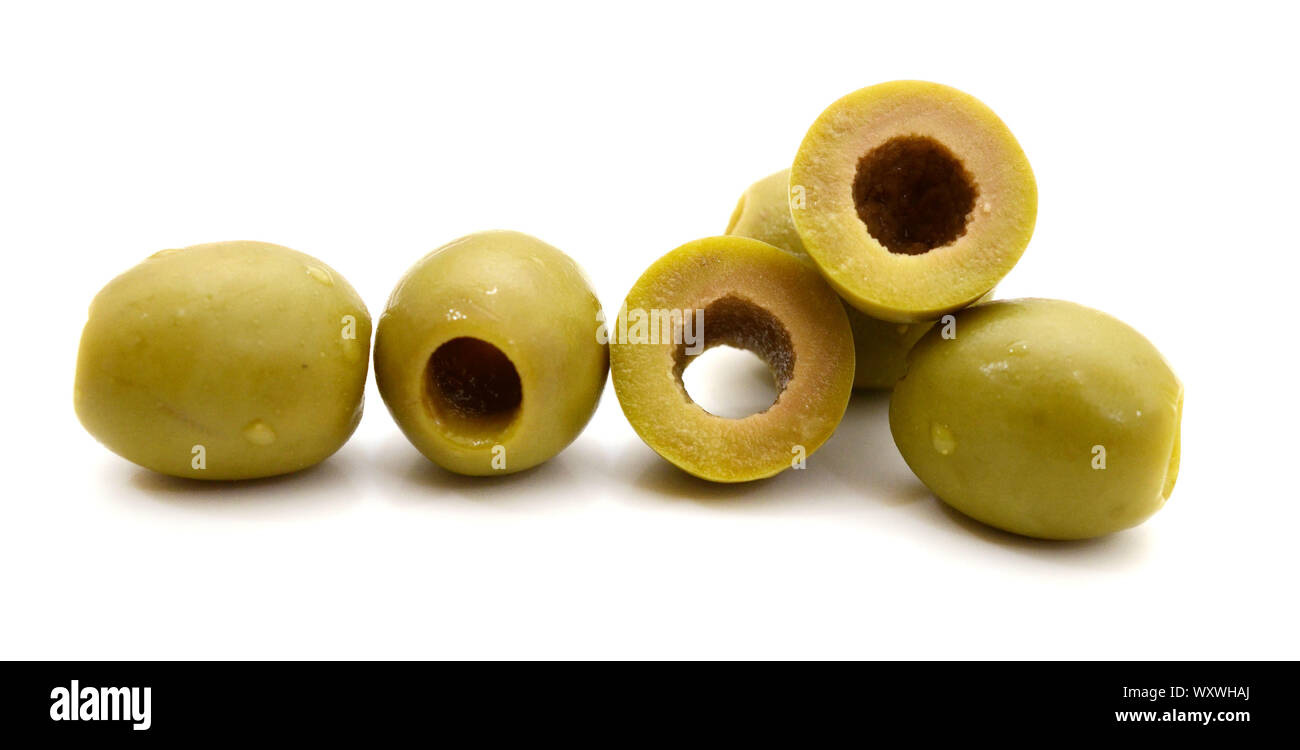Pile of green pitted olives isolated on the white background Stock