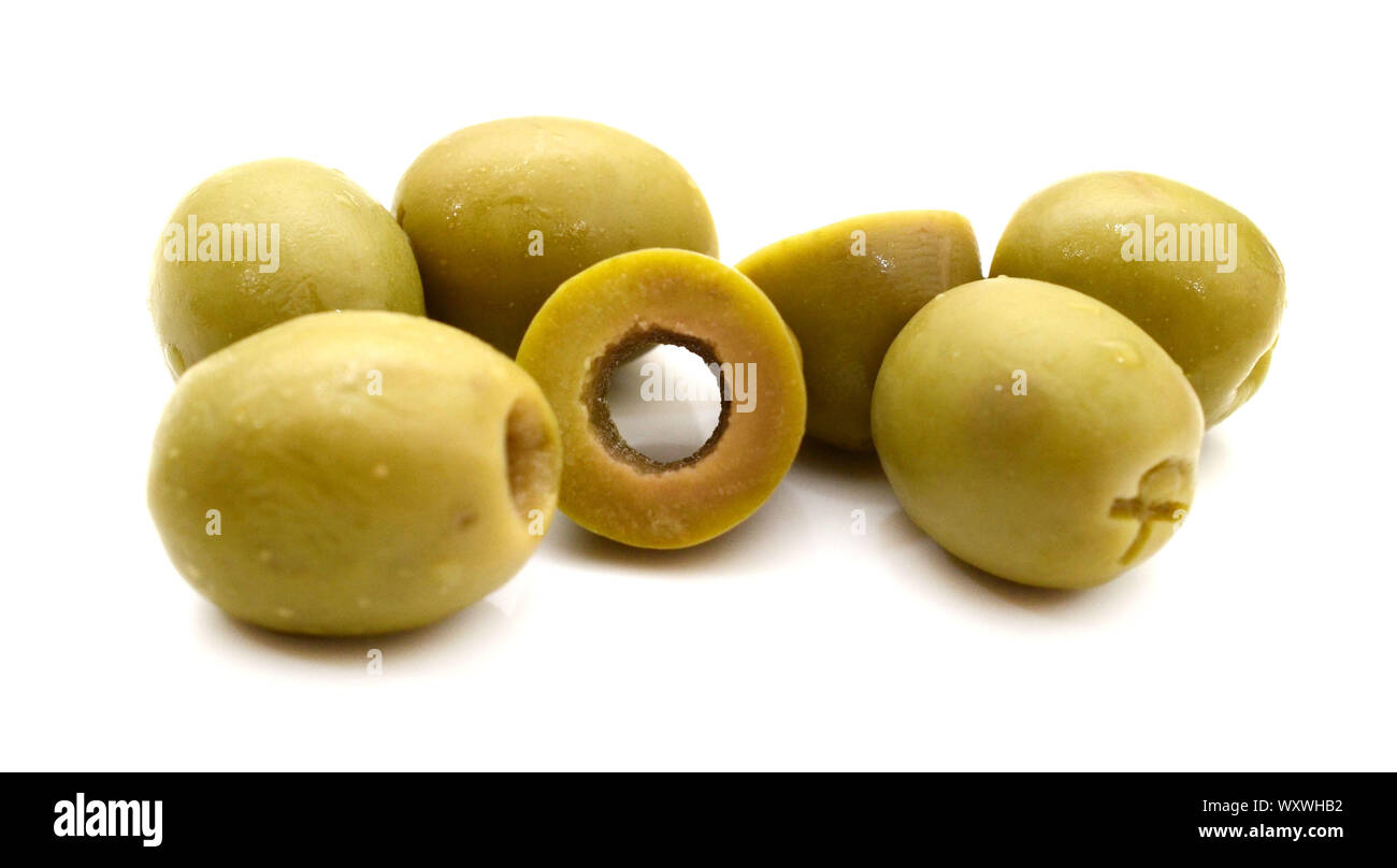Pile of green pitted olives isolated on the white background Stock