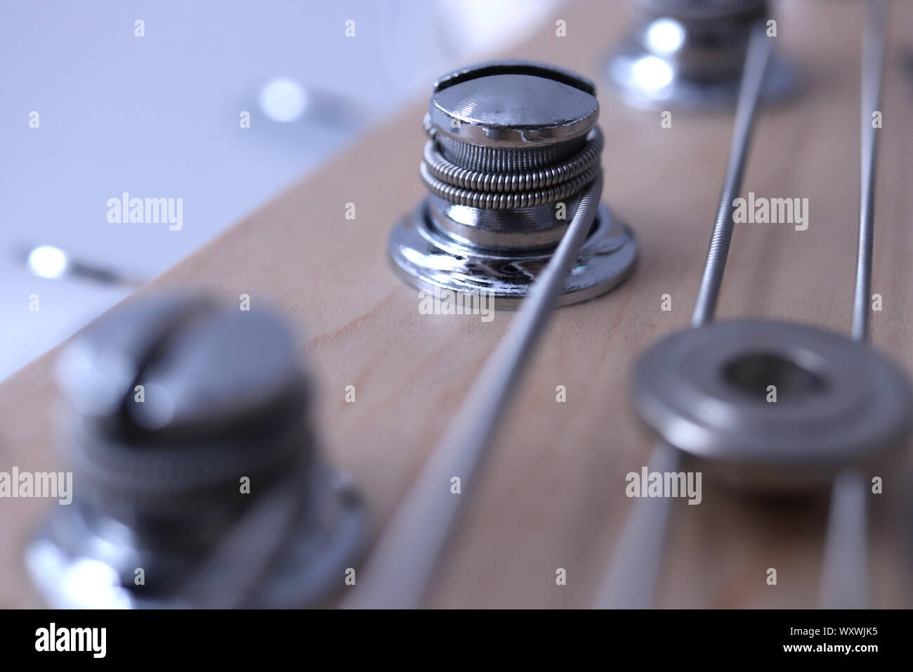 Holding string guitar tuning keys macro closeup. Music instruments