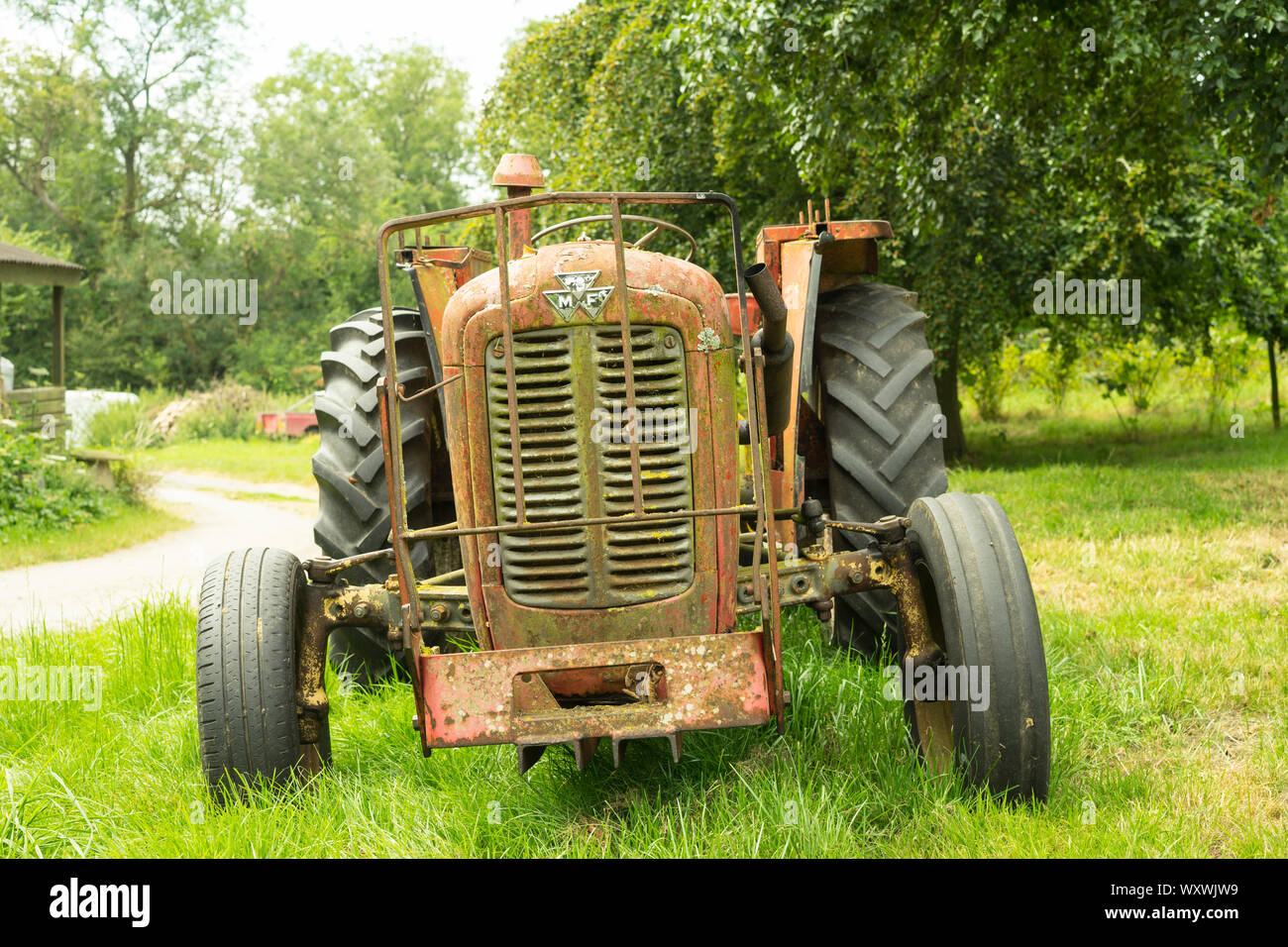 Vintage Massey Ferguson 35x Tractor With Grass Cutting Attachment Somerset England Uk Stock Photo Alamy