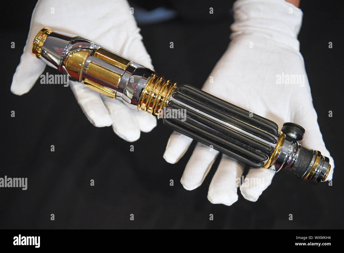 Samuel L. Jackson's 'Mace Windu' lightsaber from the film Star Wars: Revenge of the Sith, which is estimated to sell for between ??50,000 - ??100,000, on display at the Prop Store auction preview, ahead of their sale of entertainment memorabilia at the BFI IMAX in Waterloo, London. Stock Photo