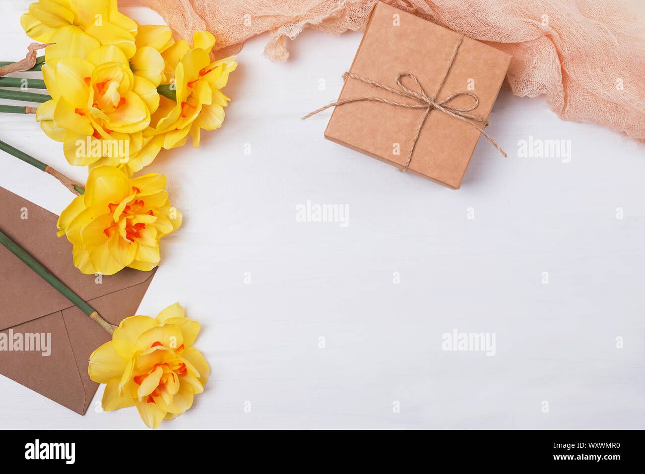 Spring composition with yellow flowers, giftbox and other objects Stock ...