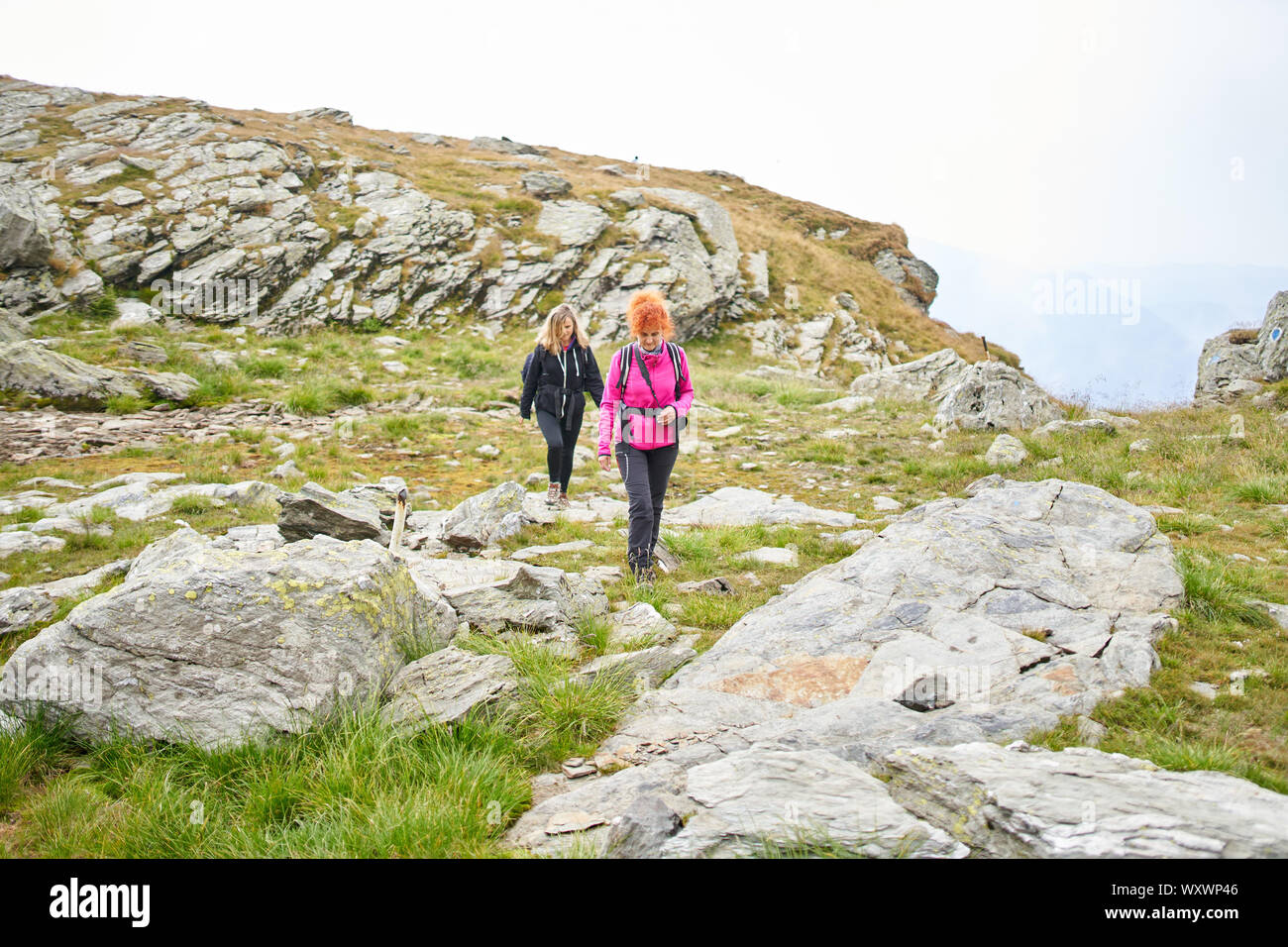 Two tourist backpacks climb hi-res stock photography and images - Alamy