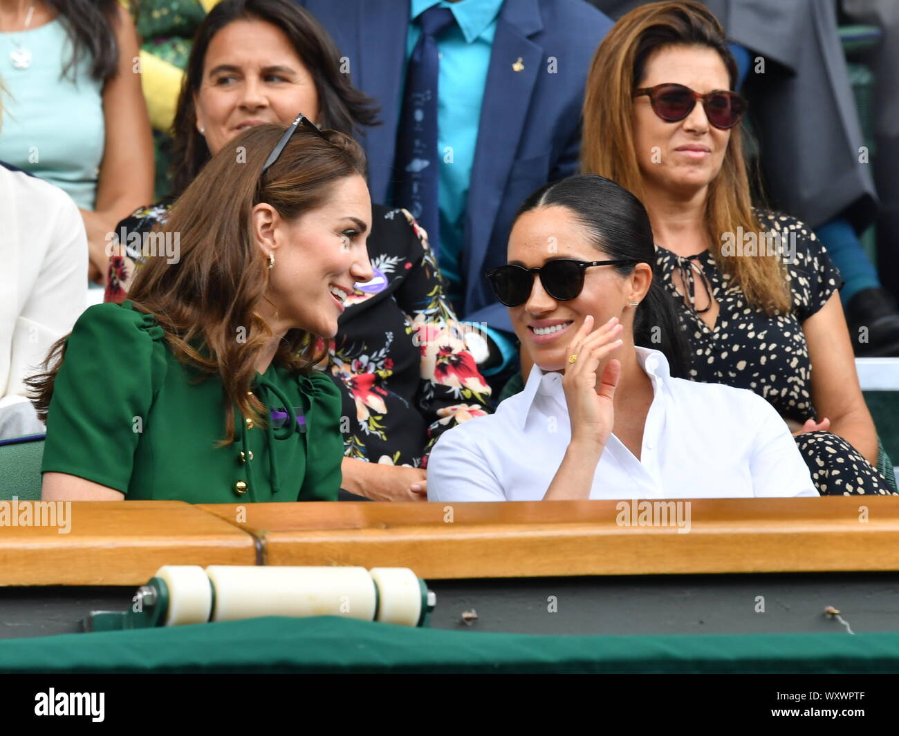 Catherine, Duchess of Cambridge, Meghan, Duchess of Sussex, Pippa Middleton in the Royal Box on Centre Court during day twelve of the Wimbledon Tennis Championships at All England Lawn Tennis and Croquet Club on July 13, 2019 in London, England. Stock Photo