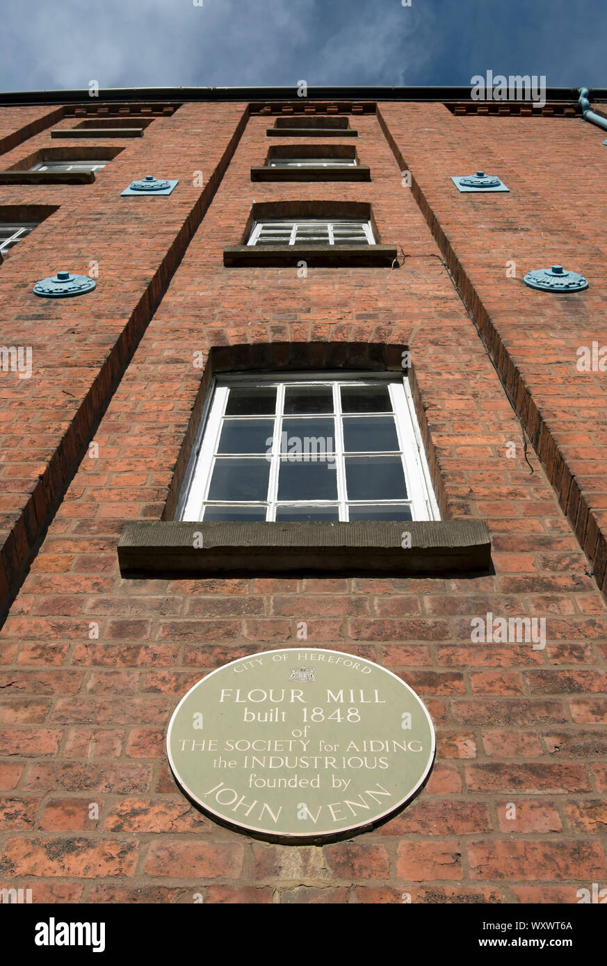 city of hereford plaque marking an 1848 flour mill of the society for aiding the industrious founded by local priest john venn Stock Photo