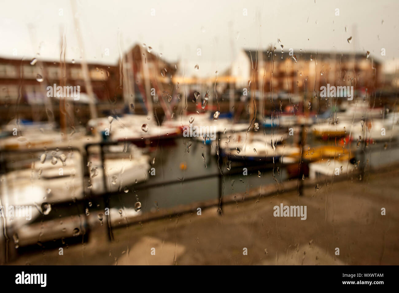 North Berwick as seen trough a glass wet with water drops.  North Berwick summer daily scenes and landscapes. Stock Photo