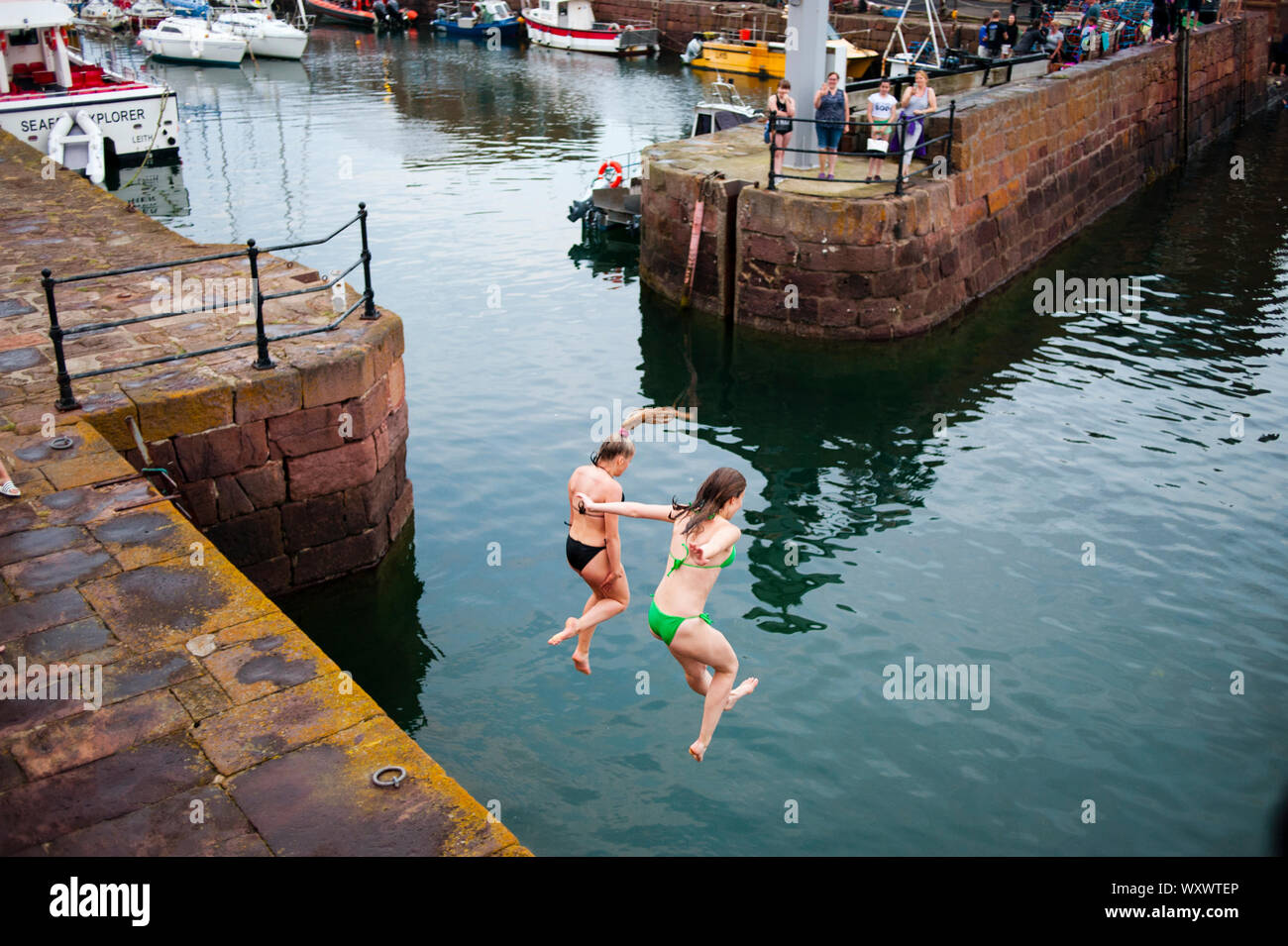 Kids Playing And Jumping Into The Water In North Berwick Harbour North Berwick Summer Daily Scenes And Landscapes Stock Photo Alamy