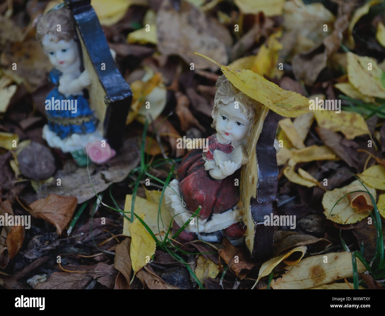 Vintage musicians porcelain dolls on the ground Stock Photo