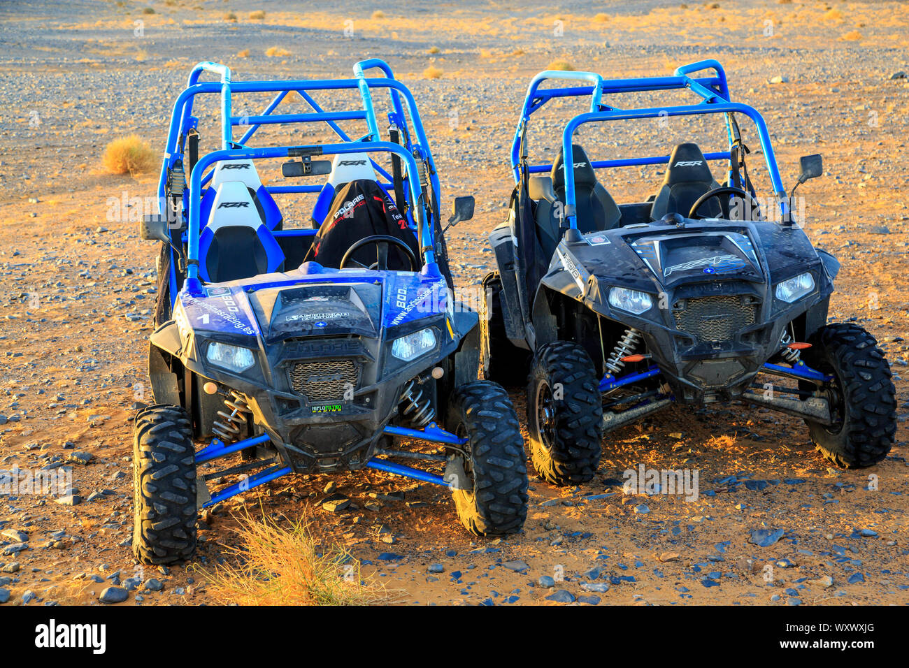Merzouga, Morocco - Feb 25, 2016: Two blue Polaris RZR 800 without pilot in Morocco desert near Merzouga. Merzouga is famous for its dunes, the highes Stock Photo