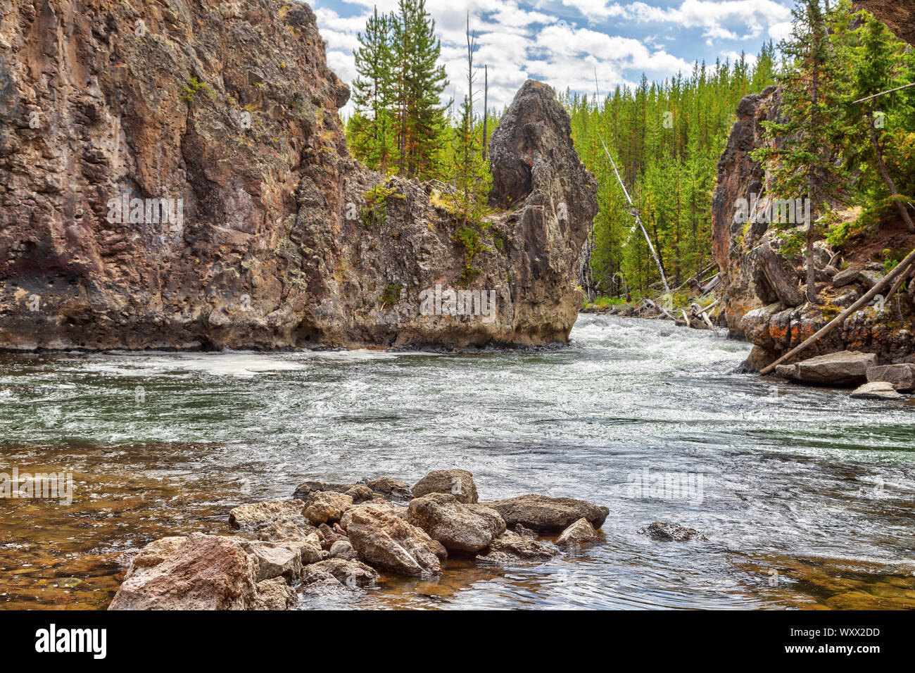 Firehole River in Yellowstone National Park, Wyoming, USA. The river flows through several significant geyser basins in Yellowstone National Park, inc Stock Photo