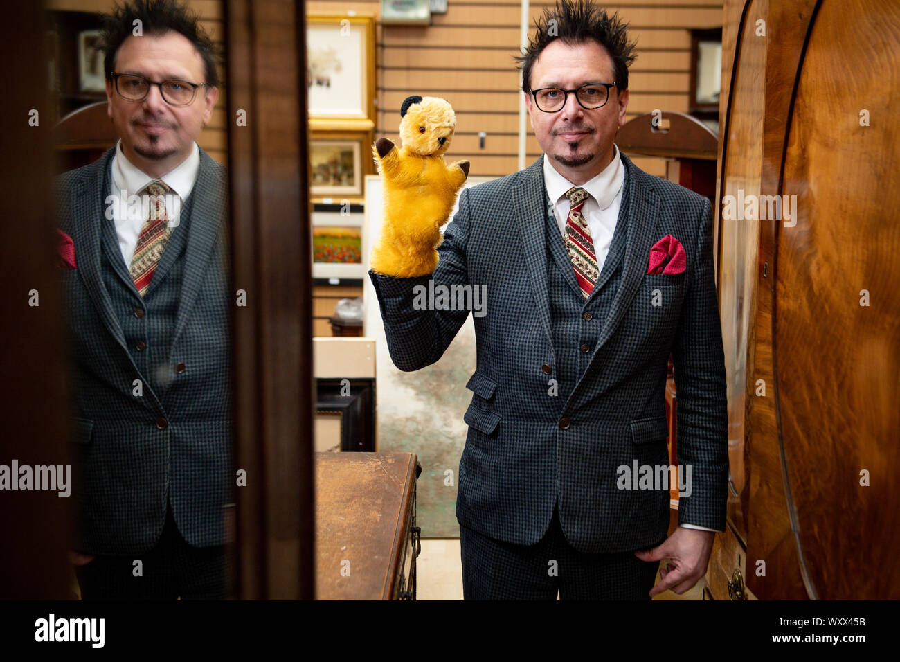 Senior Auctioneer Rik Alexander with an original Sooty TV puppet, which had been 'sitting in a box for 40 years' and could fetch over ??1000 when it goes up for auction at Hansons Auctioneers in Derbyshire on Thursday. Picture date: 18/09/19. Tina Stewart decided to sell the item after the owner of the Sooty Show, Richard Cadell, told her of its value after meeting with her and her six-year-old son Kyle after a live show. Mrs Stewart was given the TV prop by the original inventor of Sooty, Harry Corbett, who was a good friend of her father, retired biology teacher Paul Mouncey. See PA story SA Stock Photo