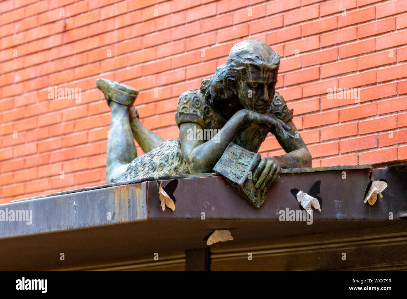 Interesting woman sculpture above on a library from Barcelona in Spain. 11. 19. 2016 Spain Stock Photo
