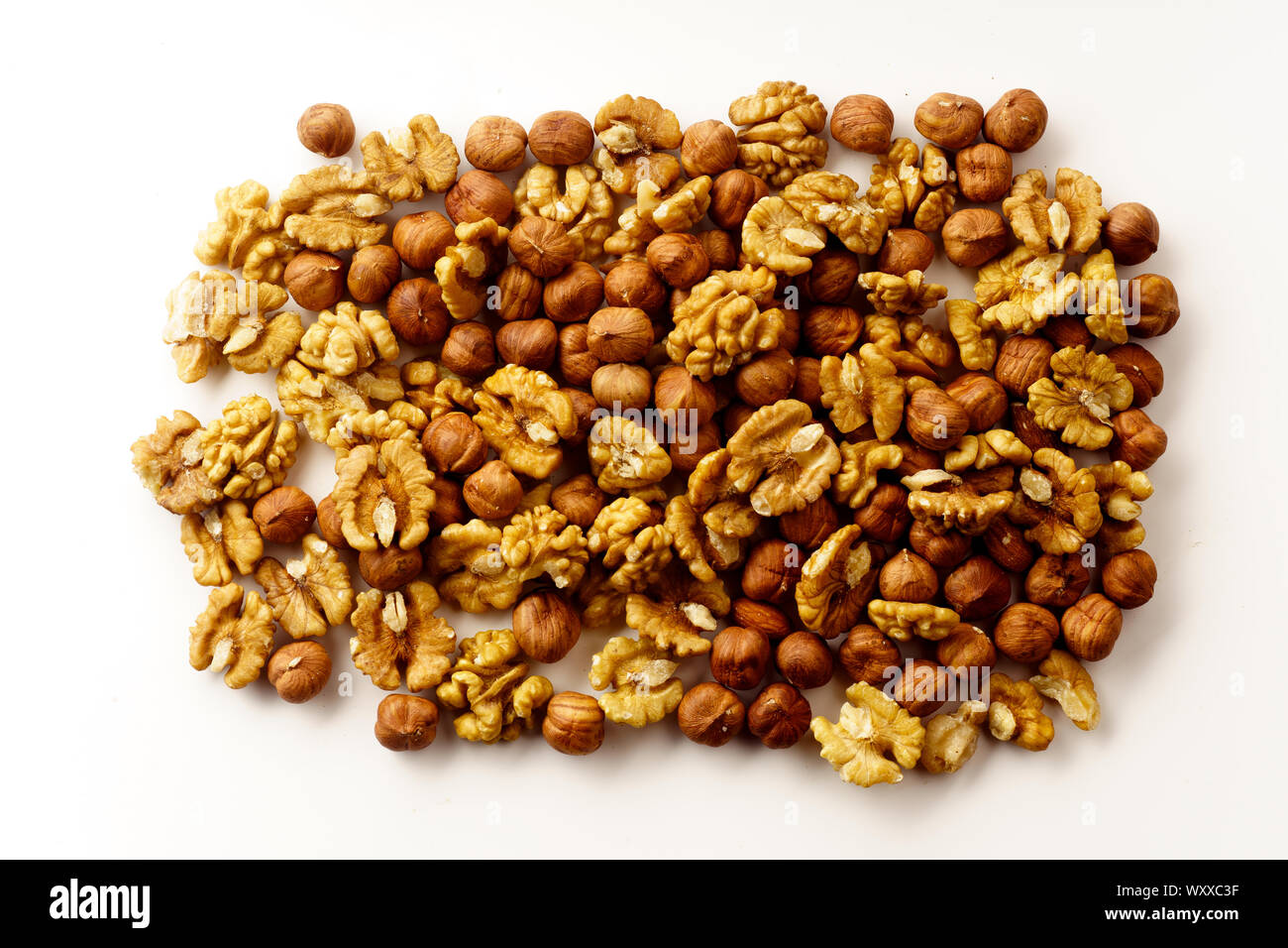 Overhead image of assorted nuts on white background Stock Photo
