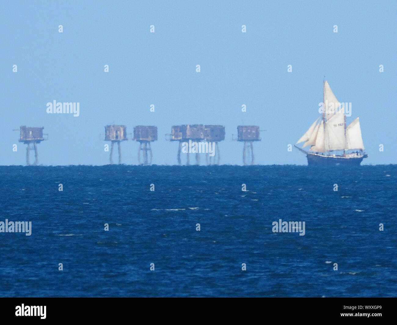 Sheerness, Kent, UK. 18th September, 2019. Classic sailing yacht 'Queen Galadriel' operated by the Cirdan Sailing Trust seen sailing across the Thames Estuary in front of the wartime Red Sands Towers. Credit: James Bell/Alamy Live News Stock Photo