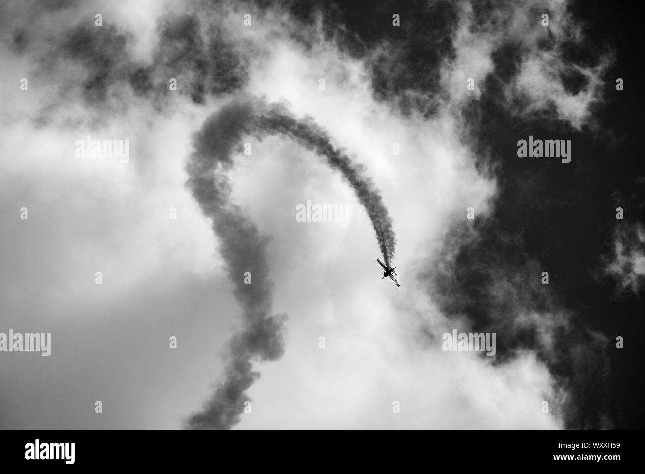 Black and white photo of an aircraft from The Blades which are a British civilian aerobatic team performing aerobatic manoeuvres. Stock Photo