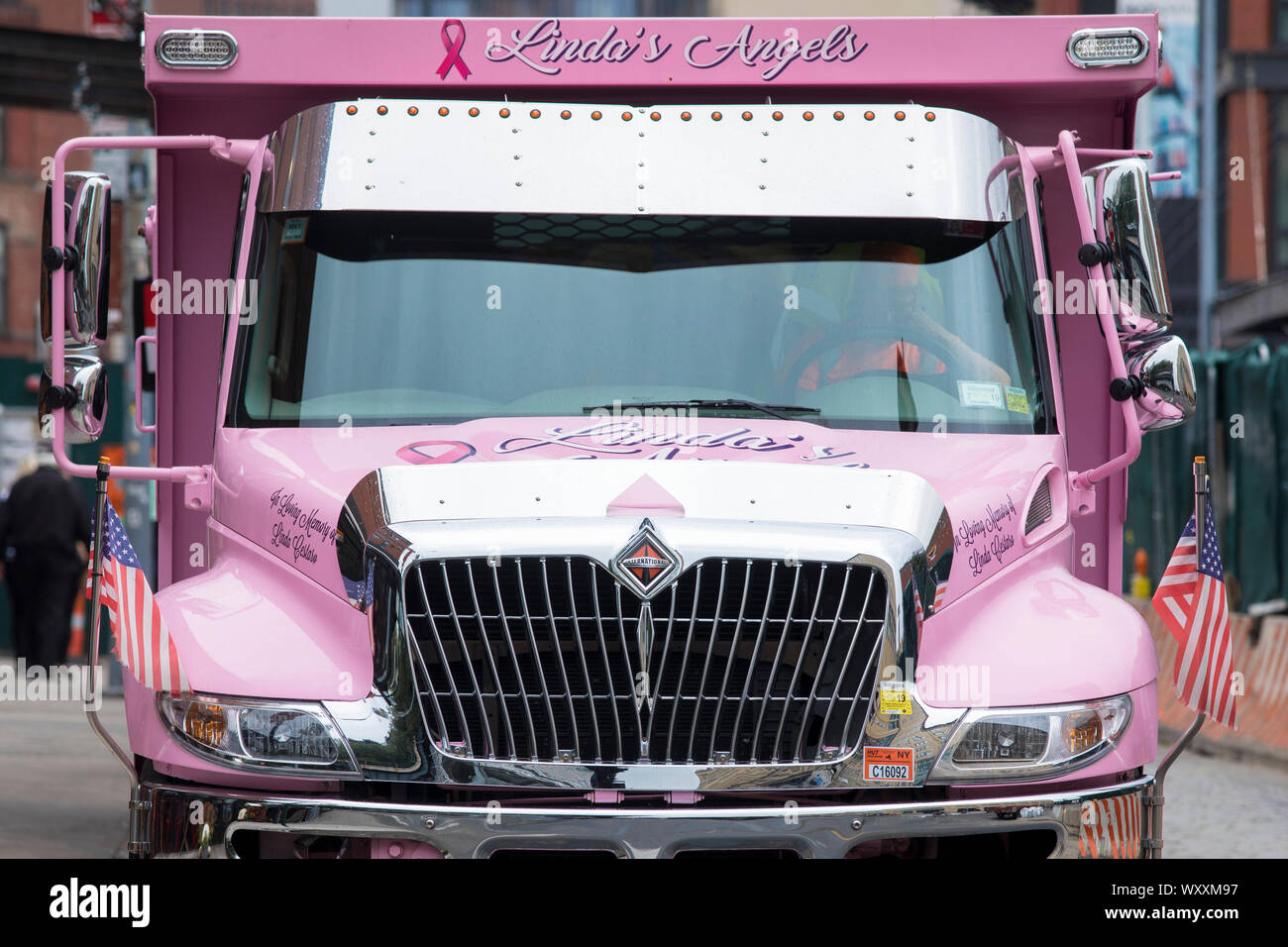 Bright pink truck painted In Loving Memory of Linda - Linda's Angels in New York City, USA Stock Photo