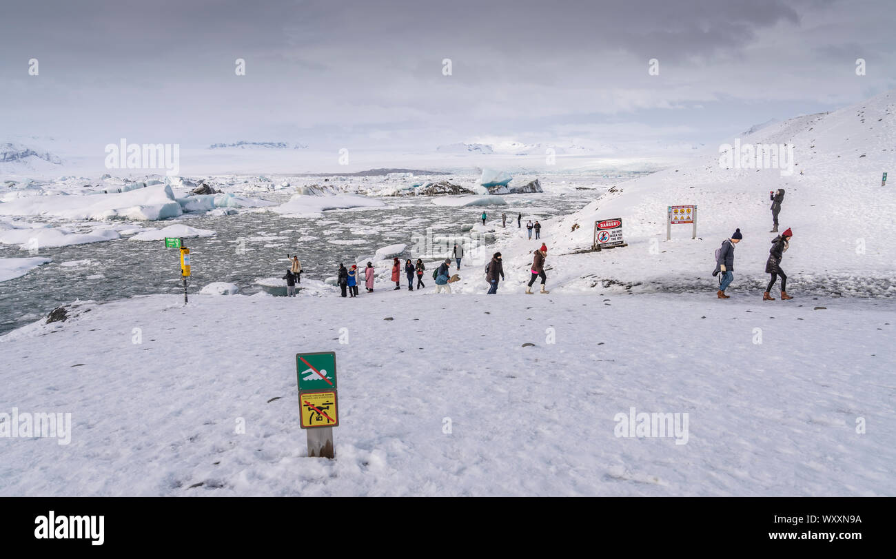 Winter -  Tourists at the Jokusarlon Glacial Lagoon, Iceland Stock Photo