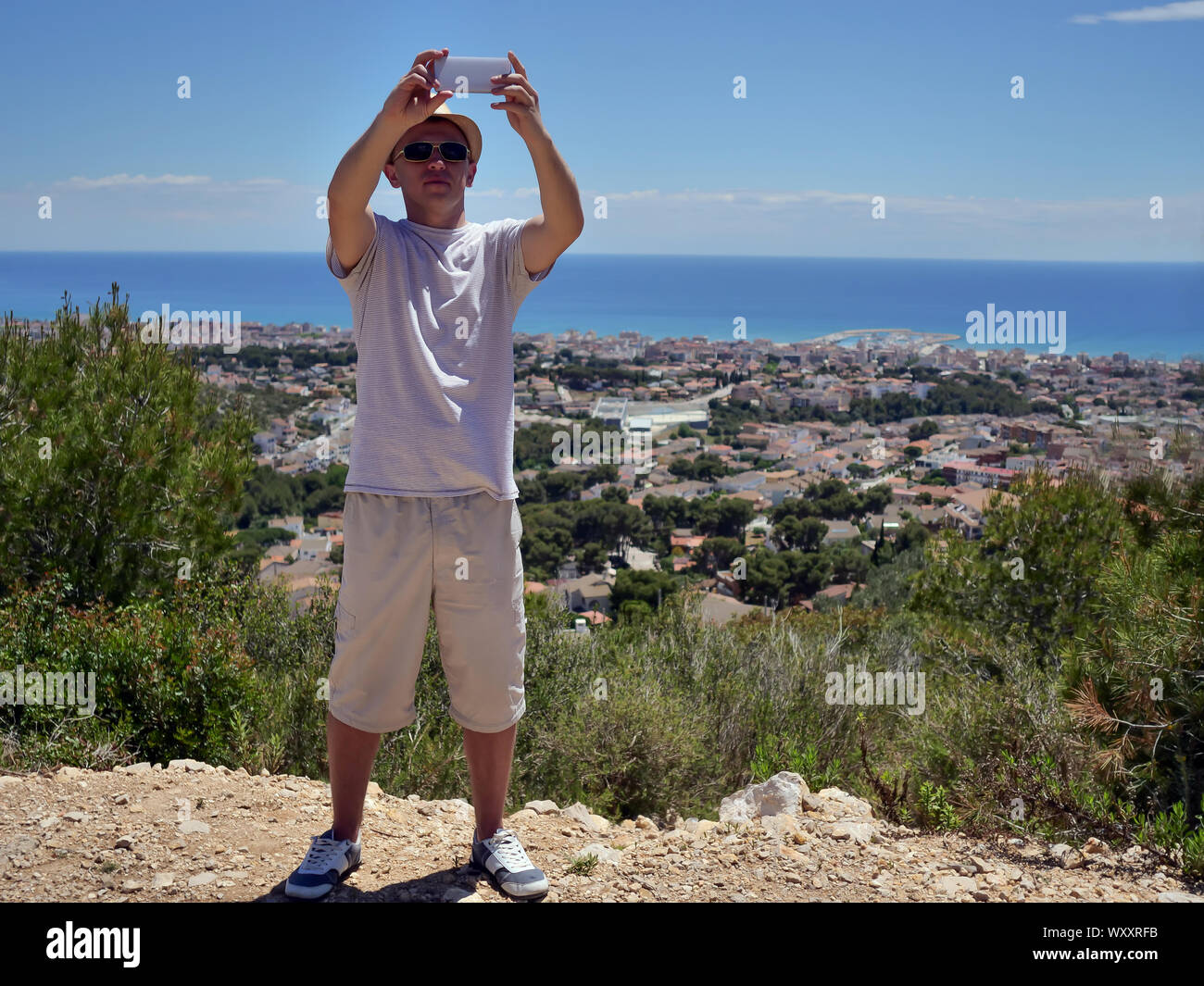 Back view happy young tourist hi-res stock photography and images - Alamy