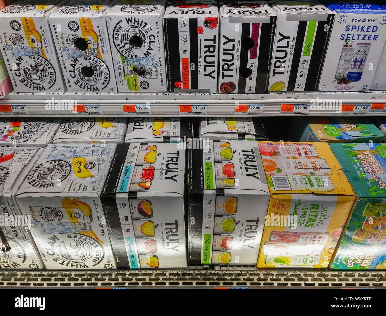 White Claw brand hard seltzer among other brands in a cooler in a supermarket in New York on Tuesday, September 3, 2019. Major beer brewers have gotten into the hard seltzer space as well Mark Anthony Brands., the owner of White Claw. (© Richard B. Levine) Stock Photo