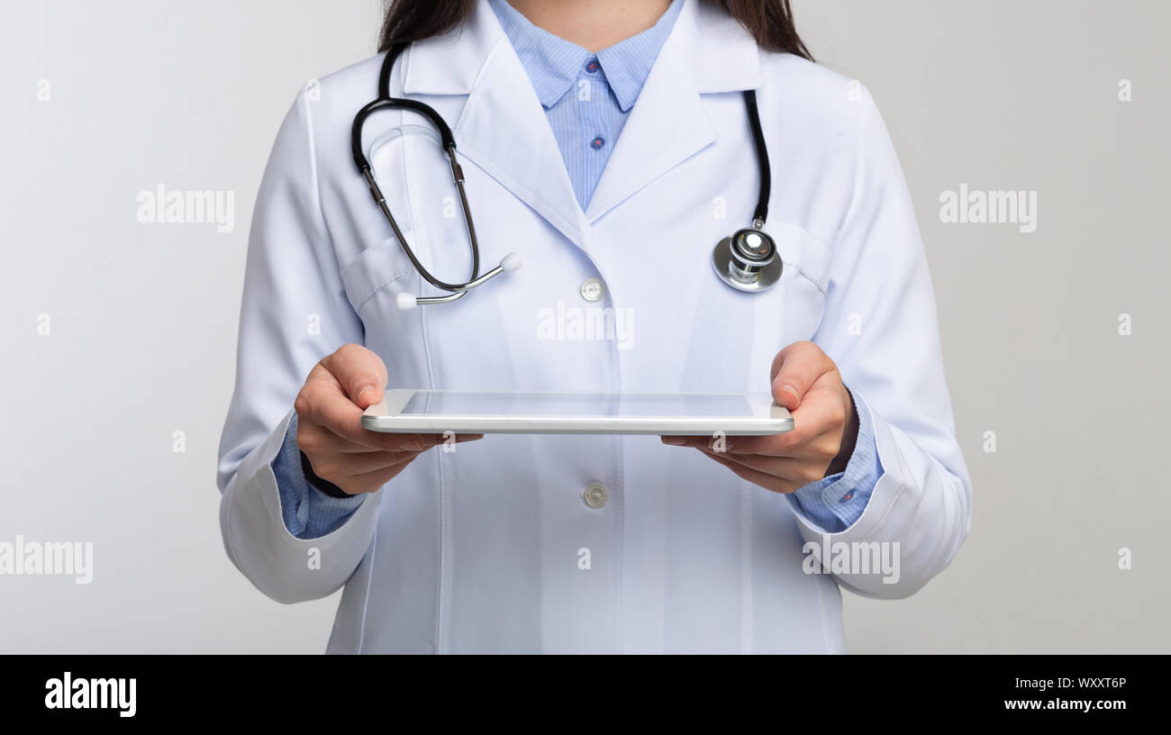 Unrecognizable Doctor Holding Tablet Standing In Studio, Panorama Stock Photo