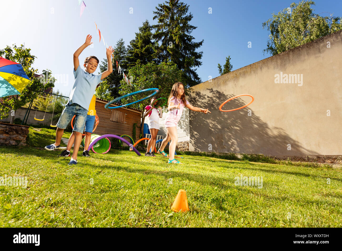 Boy And Girl As Part Of Their Team Throwing Circles To The Target