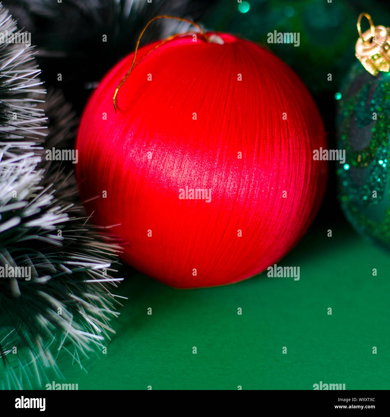 Christmas card: A red Christmas tree toy lies on a blue background ...