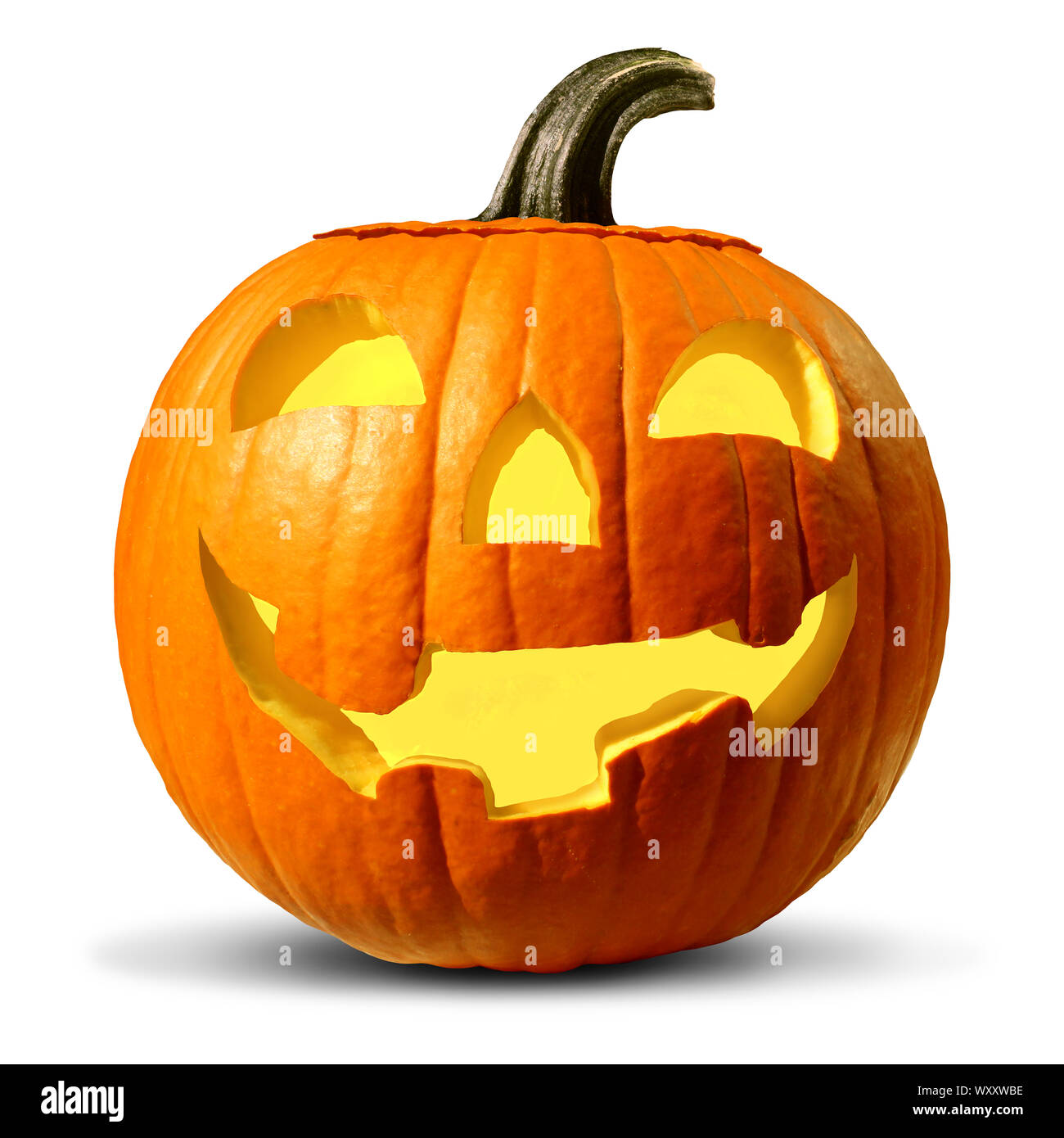 Halloween pumpkin on a white background as a jack o lantern seasonal symbol as a carved gourd with a friendly smile as a glowing orange squash. Stock Photo