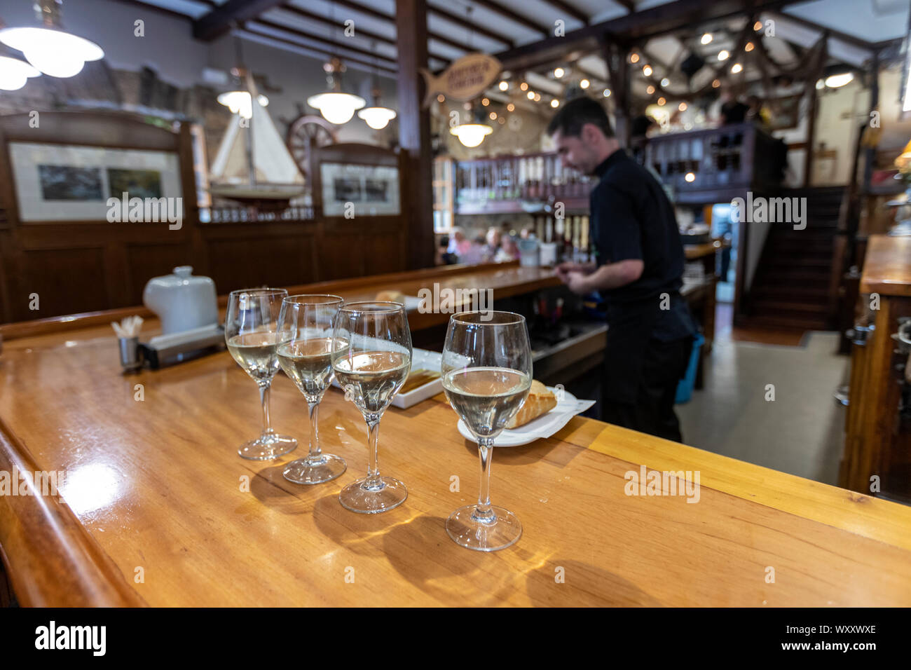 Txakoli wine glass in Asador Iribar restaurant in Getaria, Gipuzkoa,  Basque Country, Spain Stock Photo