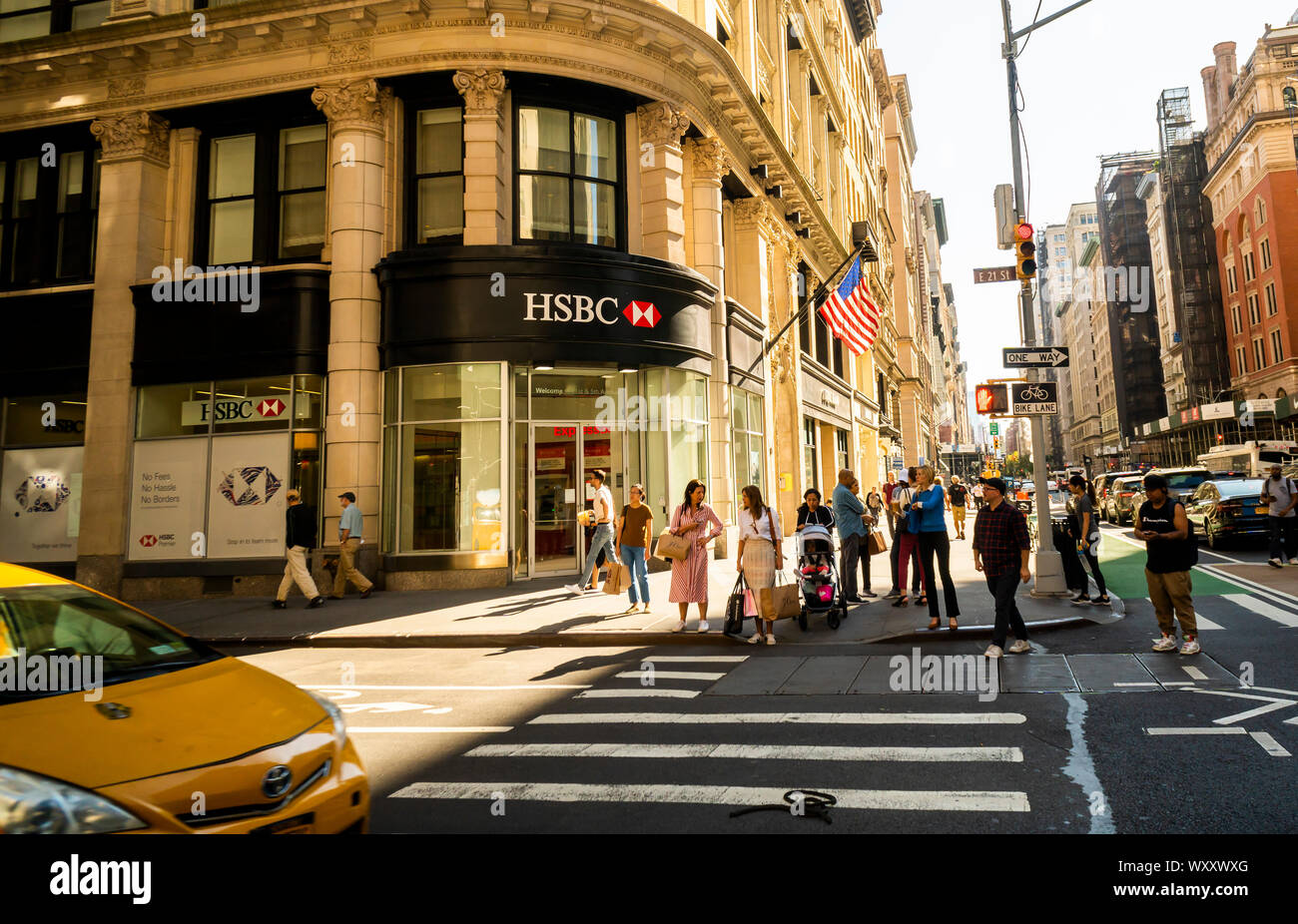 People cross in front of an HSBC bank in the Flatiron District in New York on Tuesday, September 17, 2019. (© Richard B. Levine) Stock Photo