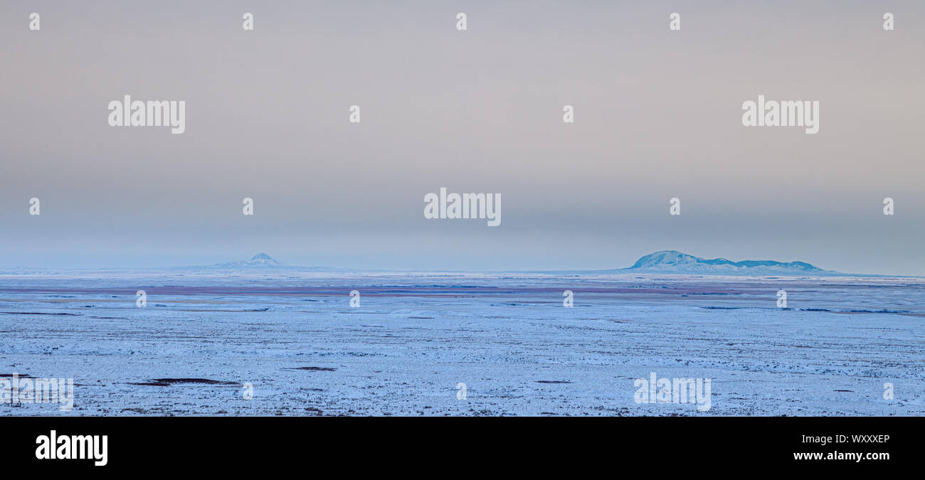 Distant view of the Sweet Grass Hills in northern Montana, USA, on a cold winter's evening Stock Photo
