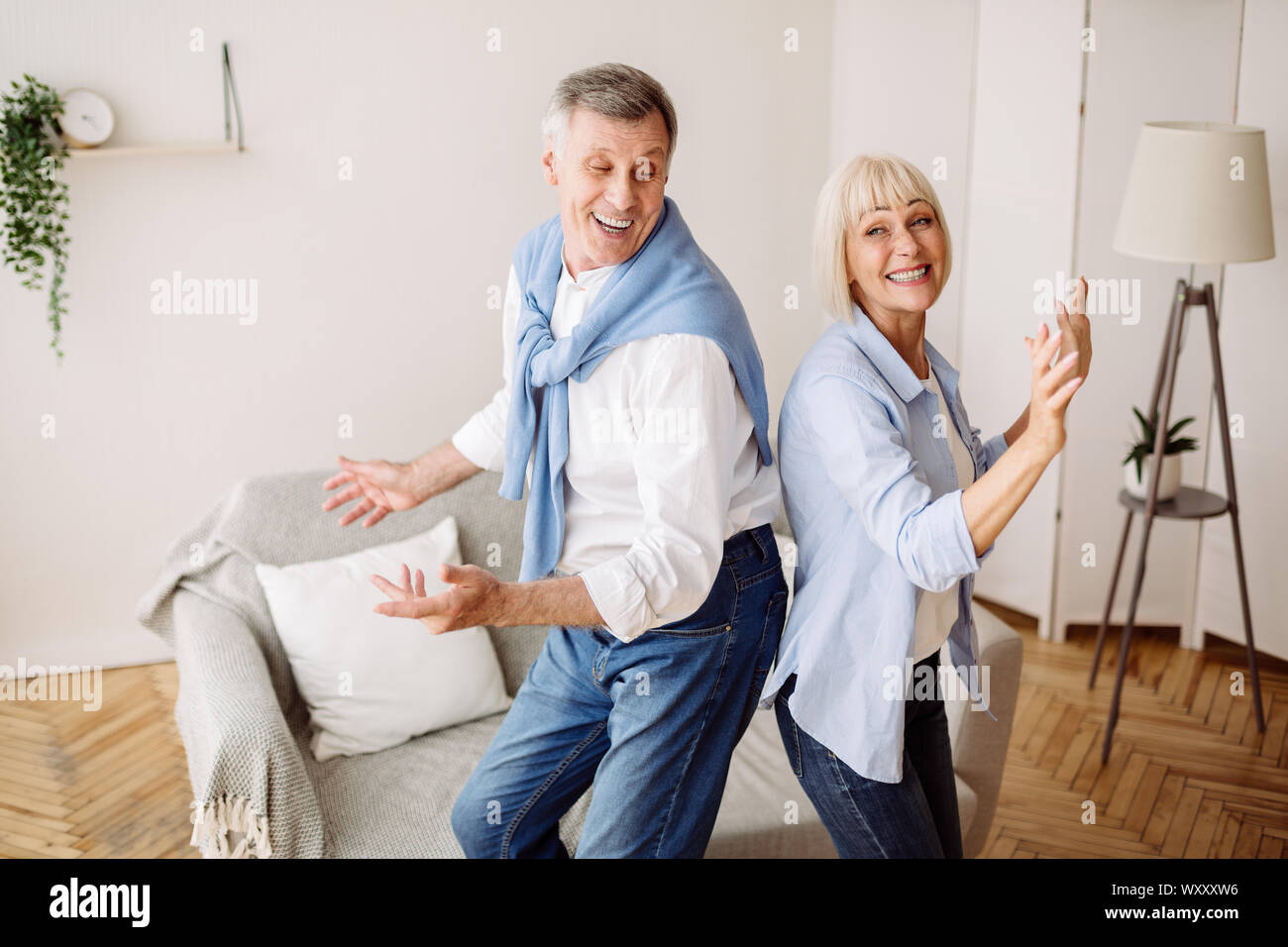 Senior couple dancing active dance at home Stock Photo