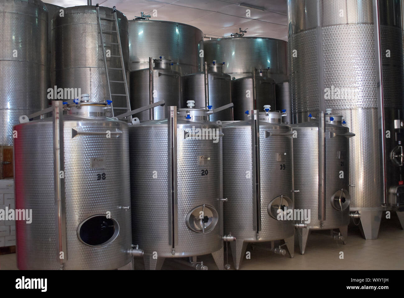 Stainless steel tanks for wine processing in an Italian winery project in Central Tanzania Stock Photo