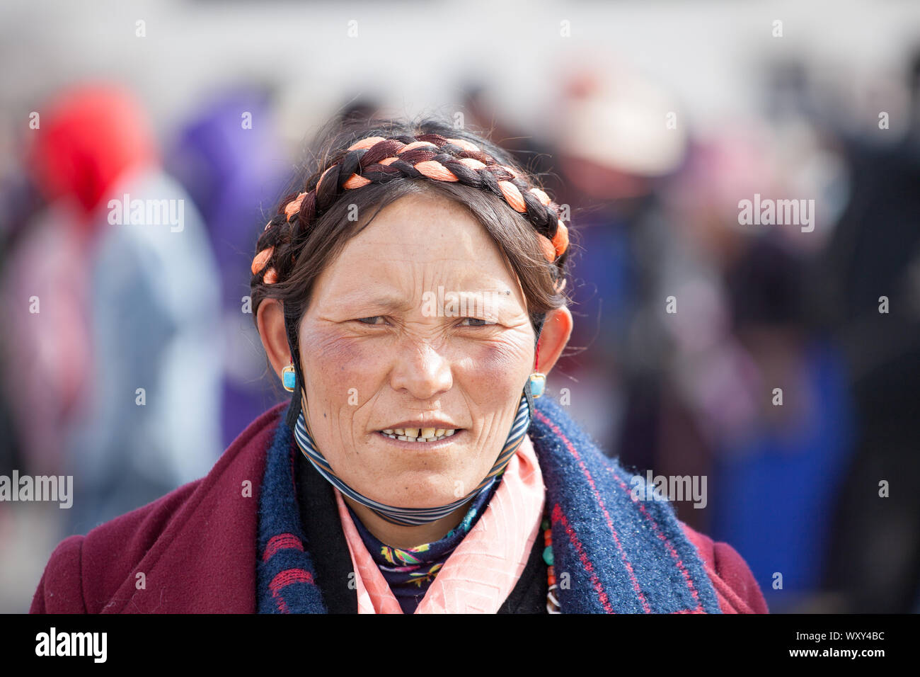 A Khampa woman, donning traditional plaits and jewelry, Lhasa, Tibet Stock Photo