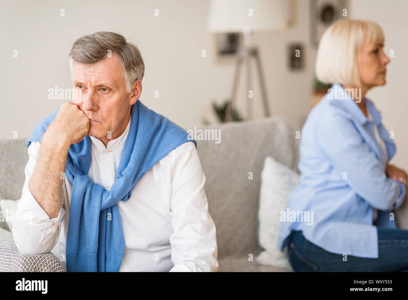 Relationship problems. Senior couple after argument sitting on sofa Stock Photo