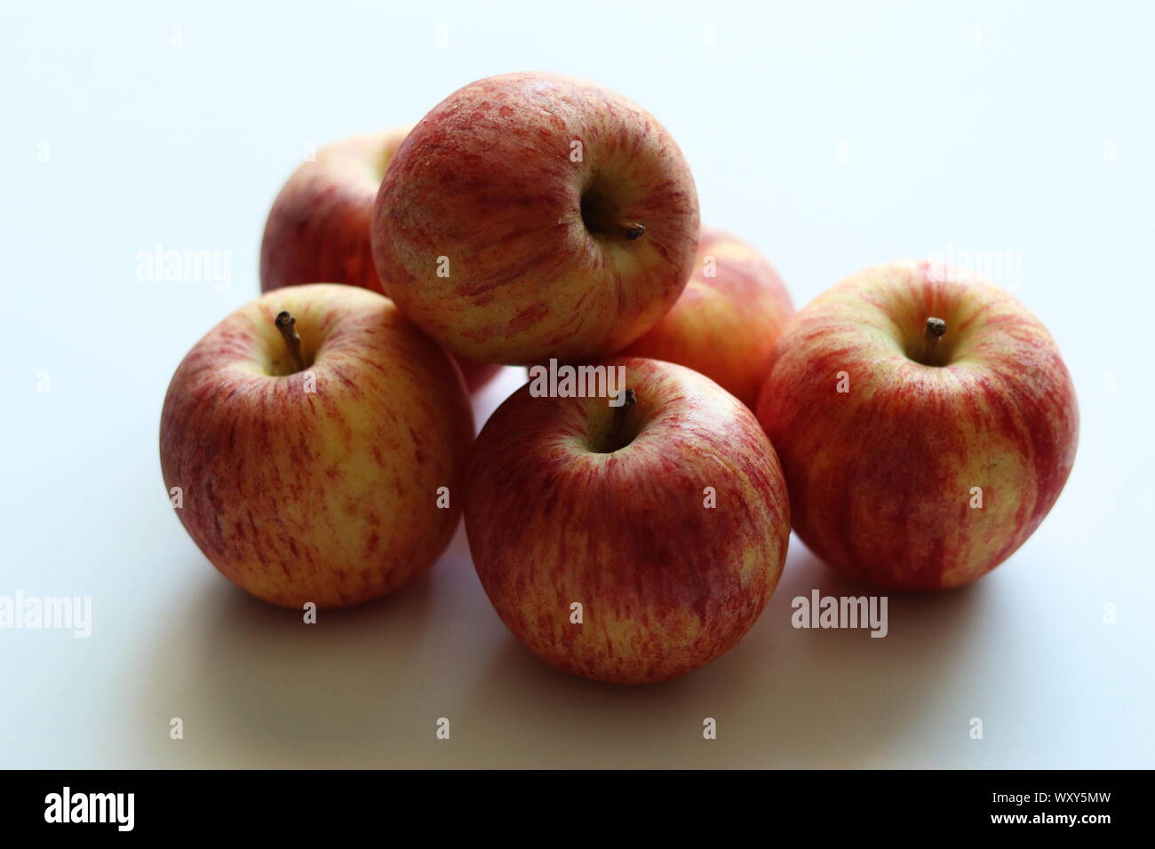 Cameo apples on plain white background Stock Photo Alamy
