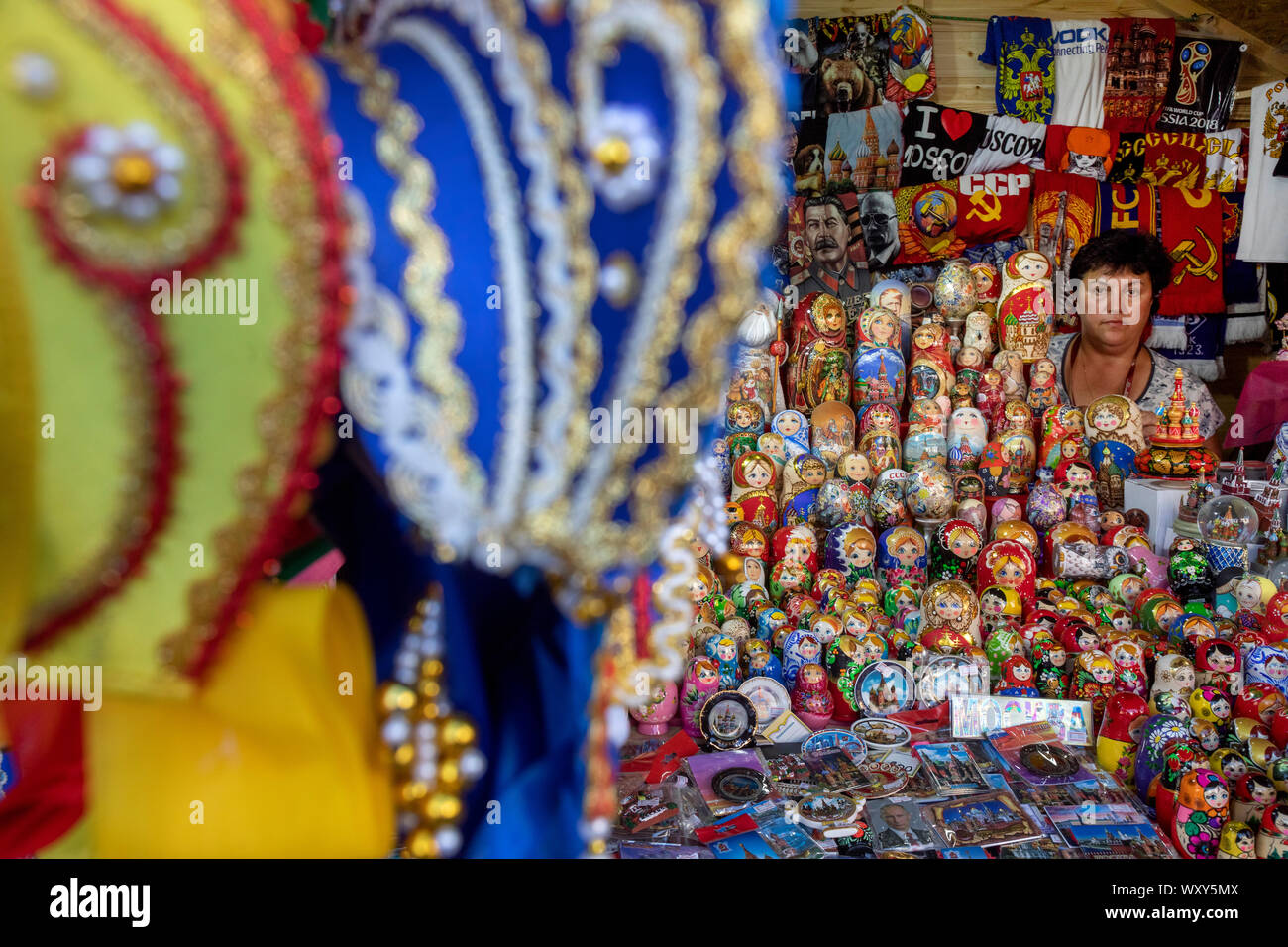 Russian Kokoshnik and Matreshka dolls in a range on a counter of a souvenir shop on Red Square in Moscow center, Russia Stock Photo