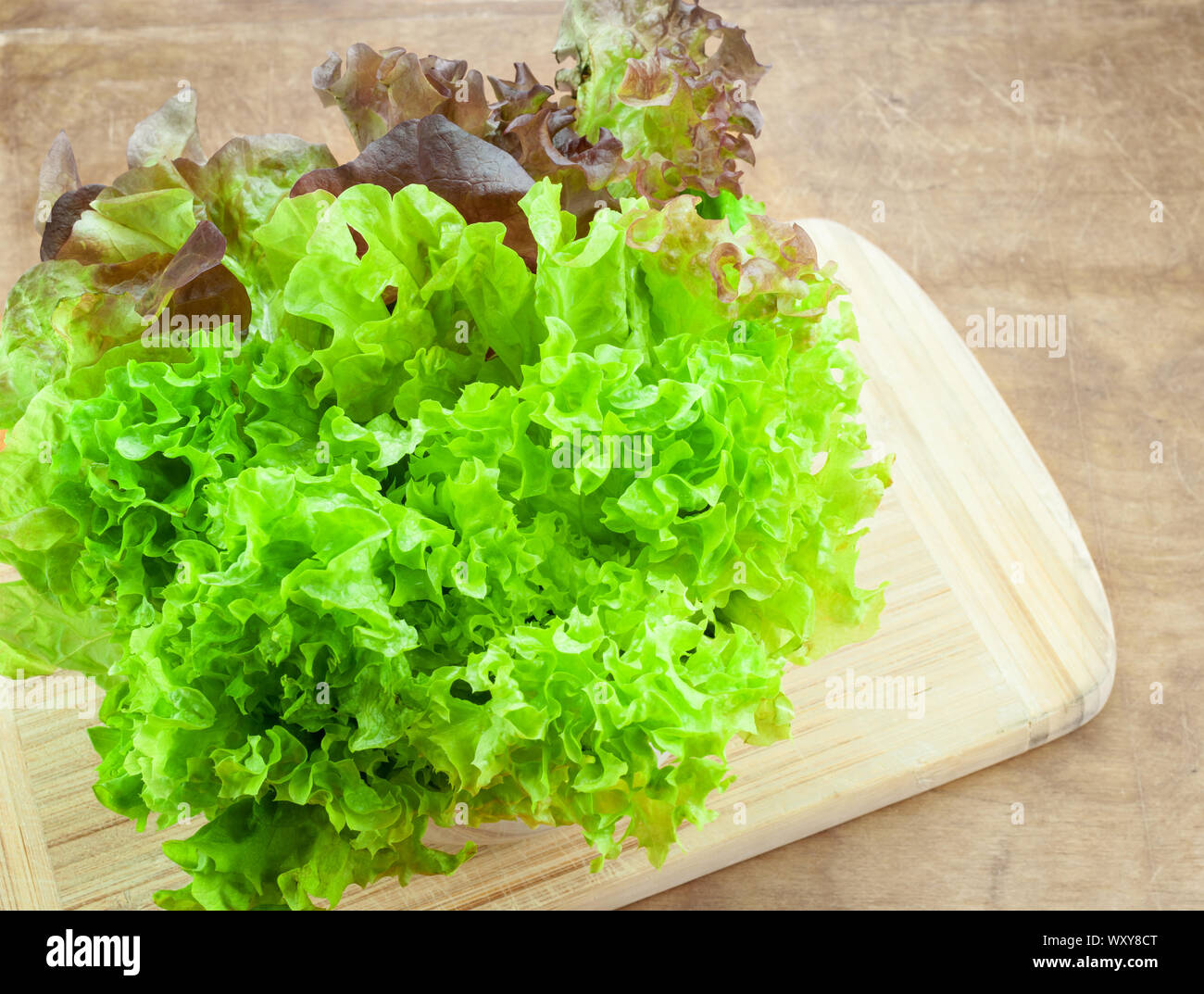 Fresh lettuce on wooden table Stock Photo - Alamy
