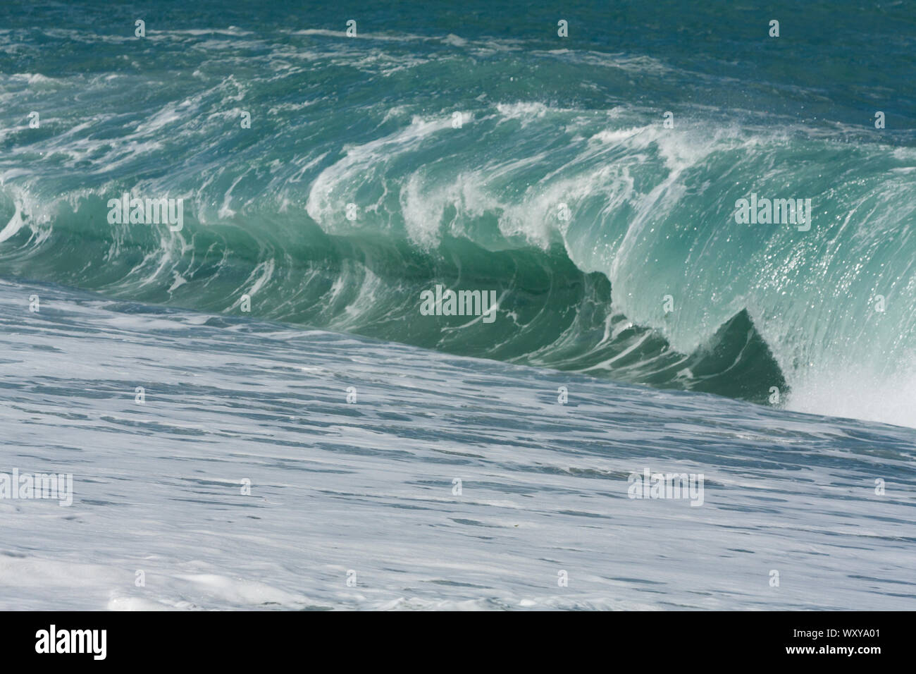 Ocean plunging or dumping waves on the beach at sunny day on seashore, Chisingtan Scenic Area, Xincheng Township, Hualien County, Taiwan Stock Photo