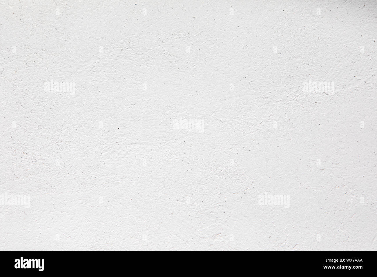 Neutral white colored low contrast Concrete textured background with