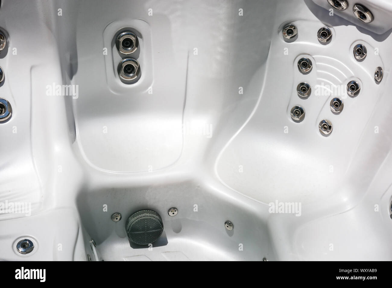 Closeup of empty bath tubs with a multitude of water spray at spa Stock