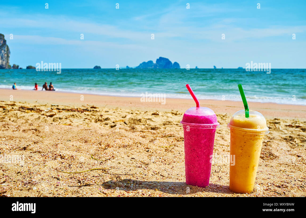 Relax on scenic Ao Nang beach with glass of refreshing tropical fruit