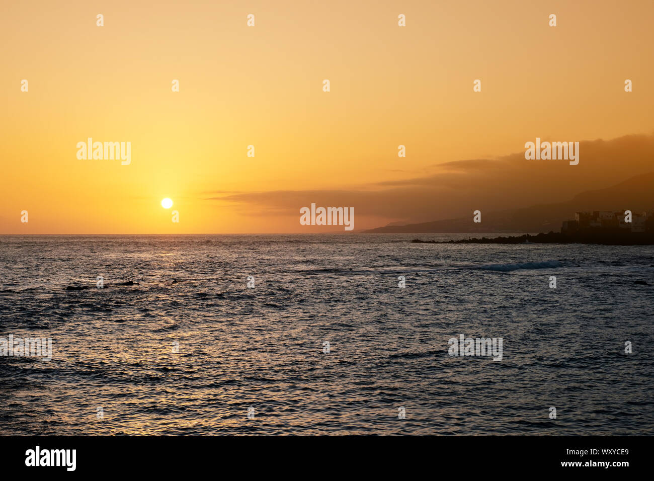 ocean horizon with sunset sky background, evening sky over water Stock Photo