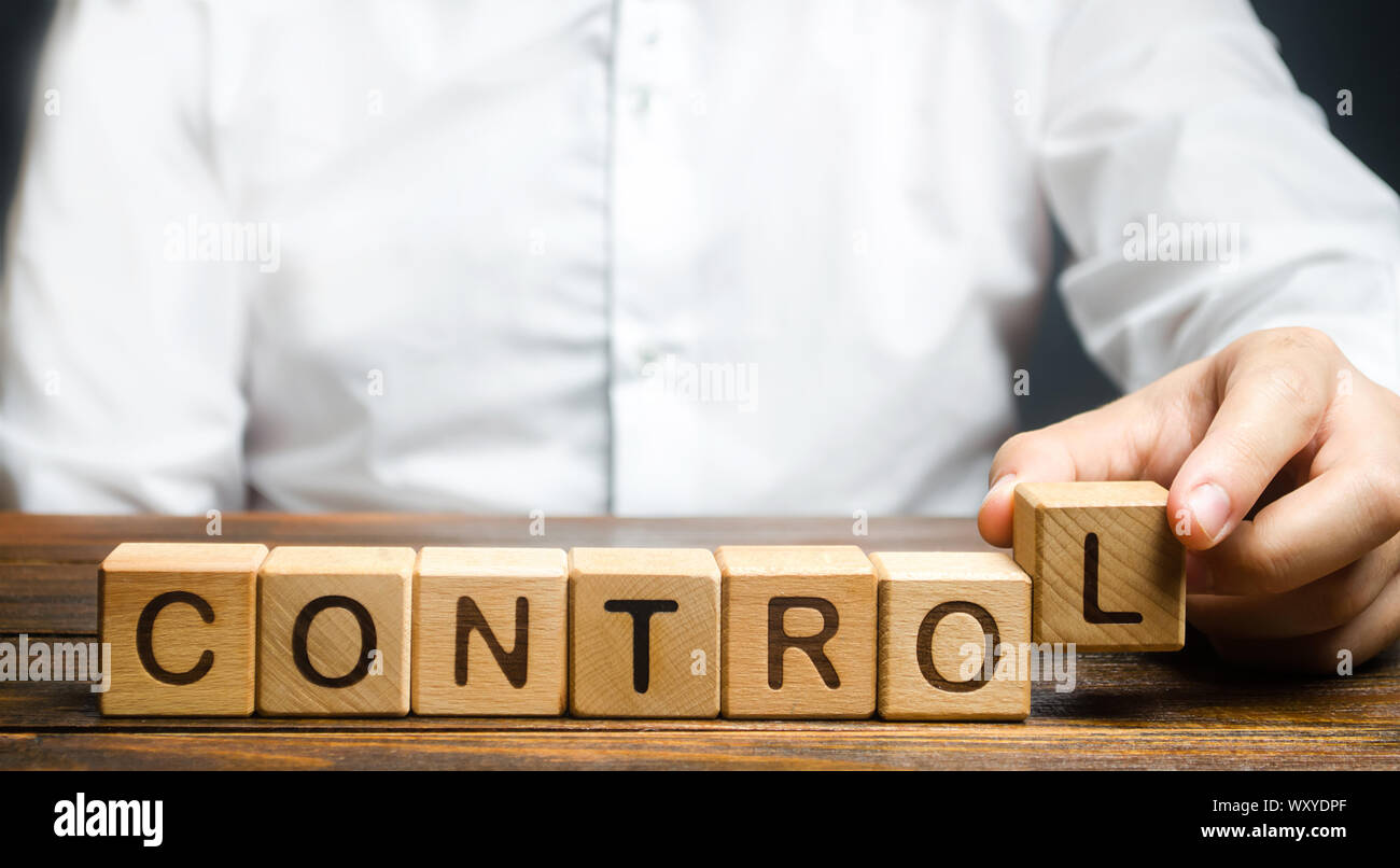 Man makes up the word Controls. Business and process management concept