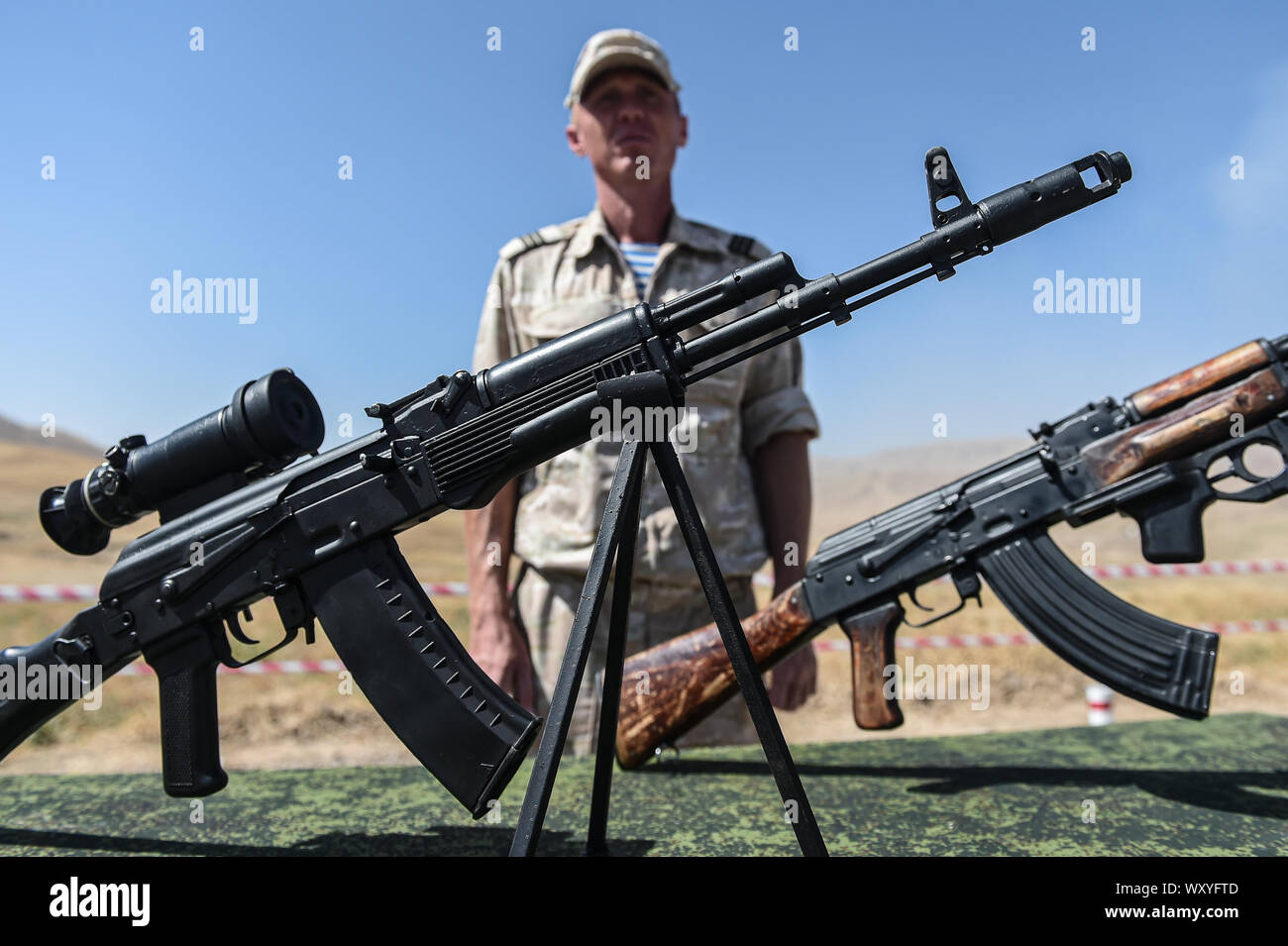 (190918) -- DUSHANBE, Sept. 18, 2019 (Xinhua) -- Russian automatic rifles AKM (L) and AK-74 are seen during the Center-2019 military exercise in Dushanbe region, Tajikistan, on Sept. 18, 2019. Tsentr-2019 (Center-2019) military exercises involving eight countries began on Monday in Russia, Kazakhstan and Tajikistan, the Russian Defense Ministry said in a statement on Tuesday. A total of 128,000 troops, more than 20,000 units of weapons and military hardware, about 600 aircraft and up to 15 ships and support vessels will take part in the drills on several training grounds in the three countries Stock Photo